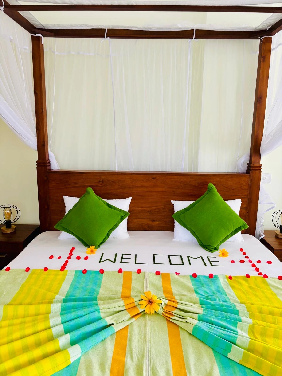 Welcome bedroom with canopy bed and Sri Lankan decor